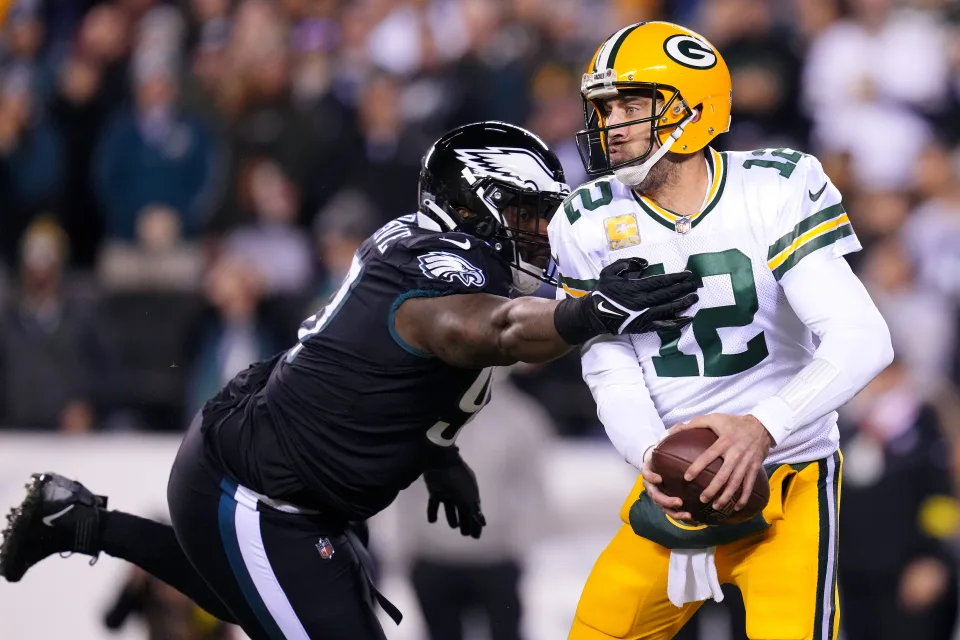 Javon Hargrave of the Philadelphia Eagles attempts to tackle Aaron Rodgers. (Photo by Mitchell Leff/Getty Images)